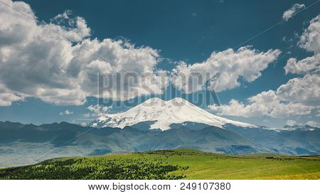 Elbrus Mount And Green Hills At Sunny Summer Day. Elbrus Region, Northern Caucasus, Russia