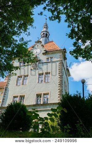 The Spire Of The Schonborn Castle Rises High Among The Beautiful Green Park. Carpathians. Ukraine