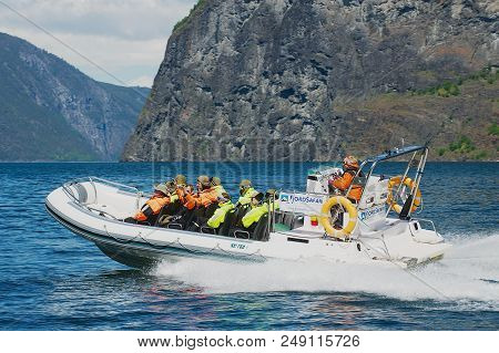 Flam, Norway - June 08,2012: Unidentified Tourists Enjoy The Safari Tour By Speed Boat At The Aurlan