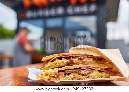 Tasty Stuffed Pita Close-up On The Table In The Street Cafe, Shallow Depth Of Field. Junk Food Snack