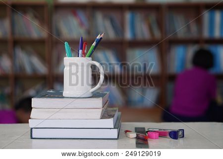 Books And Stationery On The Desk In Libraries.