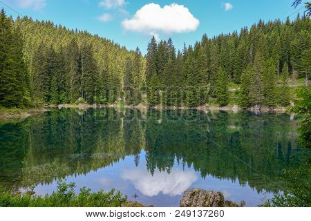 Lake Carezza With Reflection Of Mountains In The Dolomites
