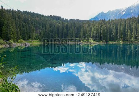 Lake Carezza With Reflection Of Mountains In The Dolomites