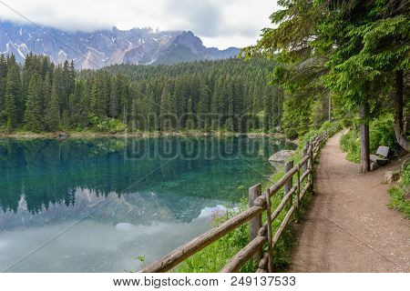 Lake Carezza With Reflection Of Mountains In The Dolomites