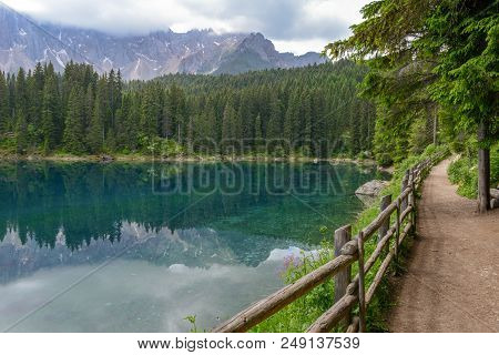 Lake Carezza With Reflection Of Mountains In The Dolomites