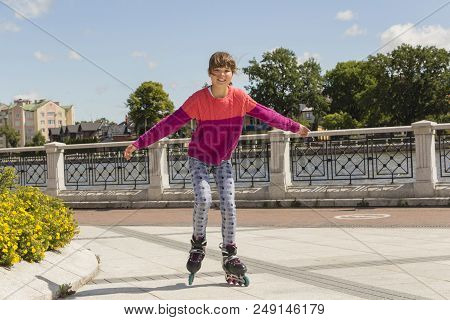 Girl On Roller Skates. Fashion, Extreme, Youth And People Concept-quite Stylish In City Park, Cool G