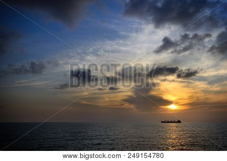 A Ship During Sunset In The Mediterranean Sea.