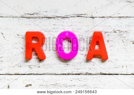 Color Alphabet In Word Roa (abbbreviation Of Return On Assets) On Grunge Old White Wood Background