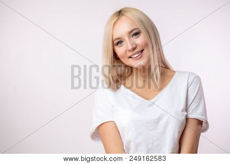 Celestrial Beauty. Young Sportswoman With Blond Long Hair In White T-shirt. Copy Space