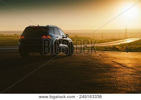 Saratov, Russia - June 07, 2018: Black Car Volkswagen Touareg Is Parked At Countryside Asphalt Road