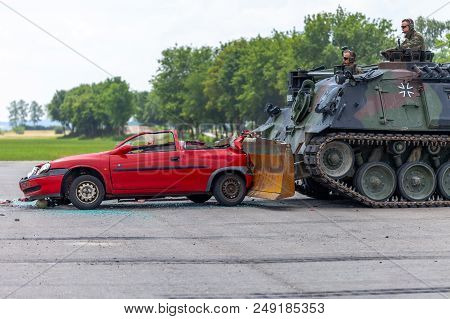 Feldkirchen / Germany - June 9, 2018: German Tank Dozer Dachs Crashes A Red Car On Day Of The Bundes