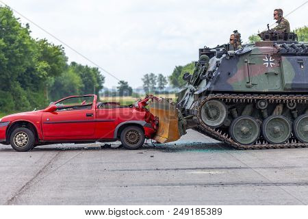 Feldkirchen / Germany - June 9, 2018: German Tank Dozer Dachs Crashes A Red Car On Day Of The Bundes