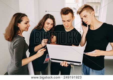 Business Team Communication. Deadline. Ideas Brainstorming. Young Male And Female Designers Discussi