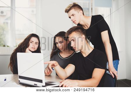 Creative Development Team At Work. Deadline. Designers Brainstorming Planning Meeting. Young Male An