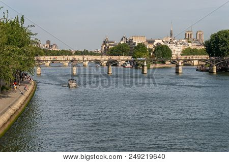 Paris, France - 24 June 2018: View Of Pont Des Arts, Ile De La Cité, And Notre-dame Cathedral.