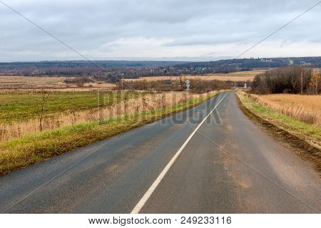 The Highway Passes Through The Autumn Field