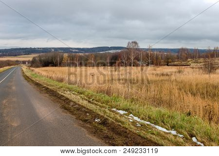 The Highway Passes Through The Autumn Field