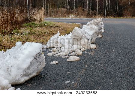 Lumps Of Snow On The Side Of The Highway After The Autumn Snowfall