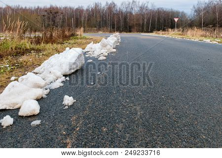 Lumps Of Snow On The Side Of The Highway After The Autumn Snowfall
