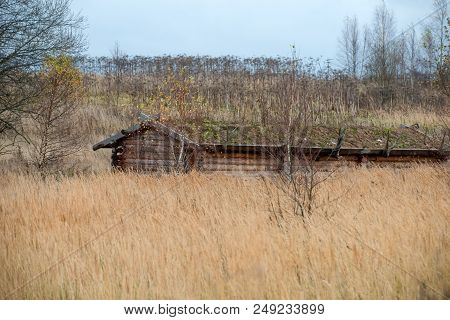 Wooden House Standing In A Thicket. Autumn Landscape.