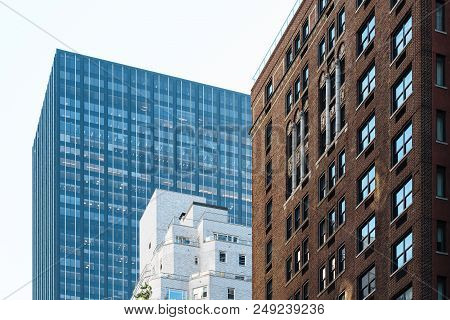 Low Angle View Of Modern And Old Buildings Against Sky In Midtown Of Manhattan