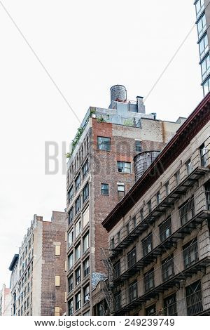 New York City, Usa - June 20, 2018: Cityscape Of Manhattan With Old Buildings And Water Towers Again