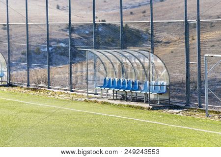 Sport Footbal Field With Wire Fence And Bench For Players
