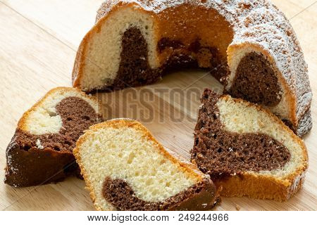Traditional Homemade Marble Cake. Sliced Marble Bundt Cake On Wooden Table