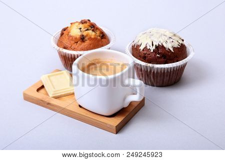 Classic Espresso In White Cup With Homemade Cake And Chocolate On White Background