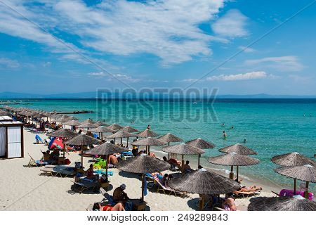 Chaniotis, Greece - June 23, 2018: Chaniotis City Beach And Clear Sea Of Chalkidiki With Many Touris