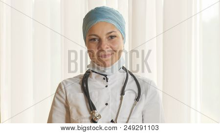 Portrait Of A Young Female Doctor In A Mask