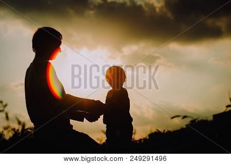 Father With Little Daughter Walk At Sunset Nature, Parenting Concept
