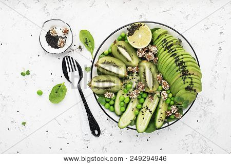 Green Fruit Vegetables Summer Detox Bowl Of Salad. Avocado, Spinach, Cucumber, Micro Greens, Blueber