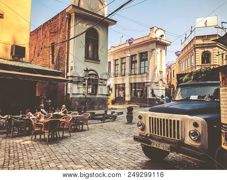 Tbilisi, Georgia - July 10, 2018: Old Town Street, Cafe In Shardeni Street. Front Of The Old Cargo C