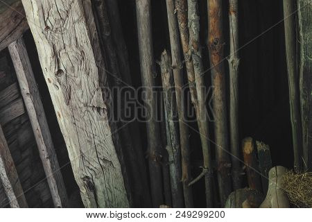 Old And Dry Wood Branches Placed In The Barn Attic Background Surface
