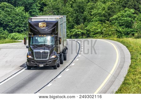 Near Knoxville, Tn, Usa - 6/5/2018: A United Parcel Service Twin-trailer Truck Travels I-40 Near Kno