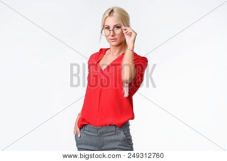 Portrait Of A Young Business Woman In A Business Suit And Glasses On An Isolated White Background