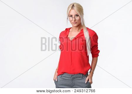 Portrait Of A Young Business Woman In A Business Suit And Glasses On An Isolated White Background