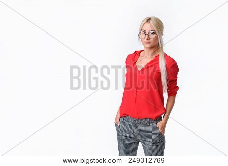 Portrait Of A Young Business Woman In A Business Suit And Glasses On An Isolated White Background