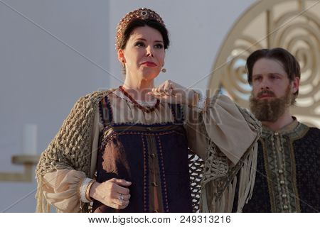 ST. PETERSBURG, RUSSIA - JULY 12, 2018: Yevgeny Chernyadiev as Sobakin (right) and Alexandra Popandopulo as Saburova in the opera The Tsar's Bride outdoors during the festival All Together Opera