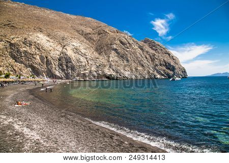 Permissa black sand beach in Santorini. Greece. 