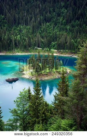 Caumasee Lake With A Small Island Located In The Middle Of The Crystal Clean Lake, Near Flims, Switz