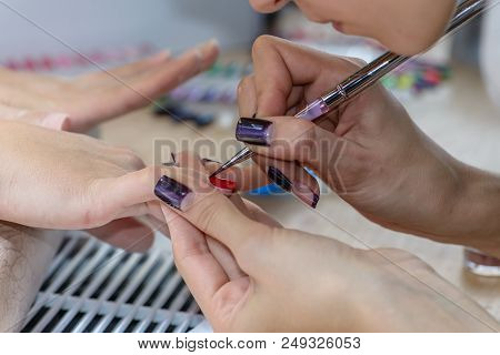 Painting Nails In Nail Salon, Uv Lap Of Quick Dry Nail Polish Manicure, Focus On Brush