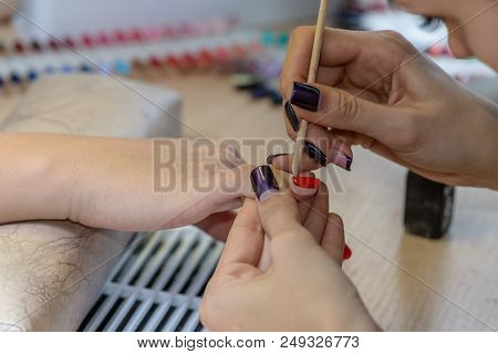 Painting Nails In Nail Salon, Uv Lap Of Quick Dry Nail Polish Manicure, Focus On Corrective Stick