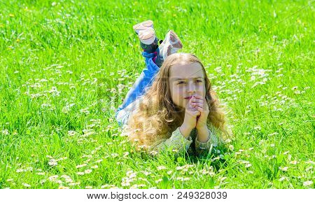 Peace And Tranquil Concept. Girl On Hopeful Dreamy Face Spend Leisure Outdoors. Child Enjoy Spring S