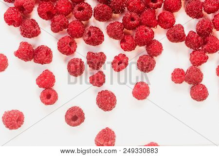 Dripping Raspberry On White Background. Close-up Photo.