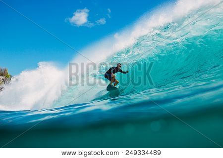 July 7, 2018. Bali, Indonesia. Surfer Ride On Big Barrel Wave At Padang Padang. Professional Surfing