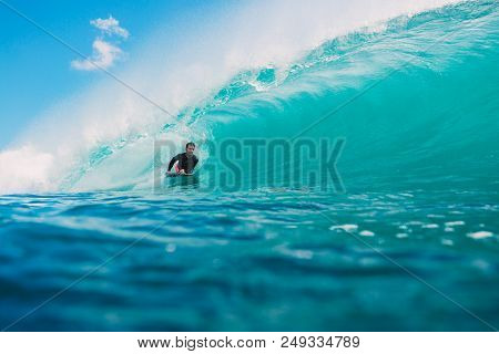 July 7, 2018. Bali, Indonesia. Bodysurfer Ride On Big Barrel Wave At Padang Padang. Professional Sur