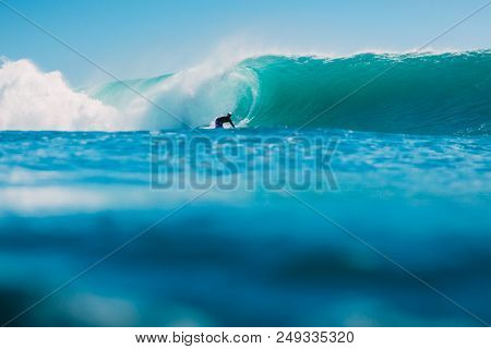 July 7, 2018. Bali, Indonesia. Surfer Ride On Big Barrel Wave At Padang Padang. Professional Surfing