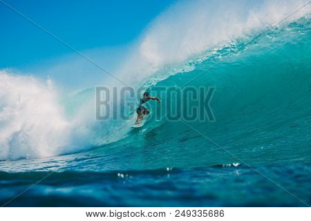 July 7, 2018. Bali, Indonesia. Surfer Ride On Big Barrel Wave At Padang Padang. Professional Surfing